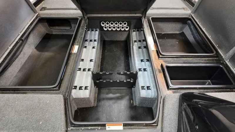 Slide: The Image of 2023 Lowe Stinger 198 boat storage compartments and rod holders. - 12