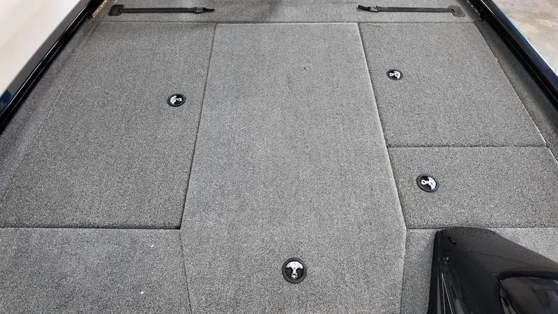 Slide: The Image of 2023 Lowe Stinger 198 boat deck with gray carpet and storage compartments. - 13