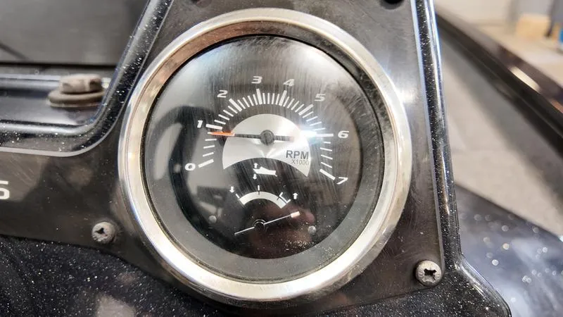 Slide: The Image of Close-up of 2023 Lowe Stinger 198 RPM gauge on dashboard. - 15