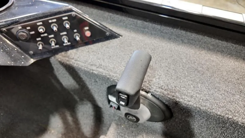 Slide: The Image of 2023 Lowe Stinger 198 boat control panel and throttle lever. - 18