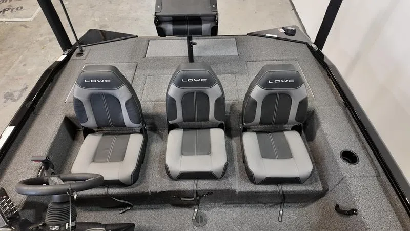 Slide: The Image of 2023 Lowe Stinger 198 boat interior with three gray seats. - 19