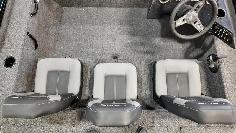 Slide: The Image of 2023 Lowe Stinger 198 boat interior with three gray seats and steering wheel. - 20