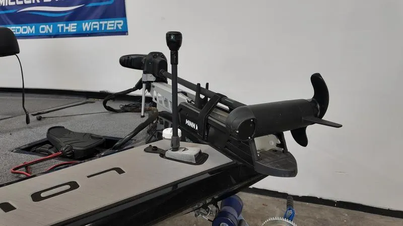 Slide: The Image of 2023 Lowe Stinger 198 boat with trolling motor in a showroom. - 3