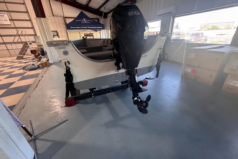 Slide: The Image of 2023 Starcraft Alaskan 12 boat with outboard motor in showroom. - 3