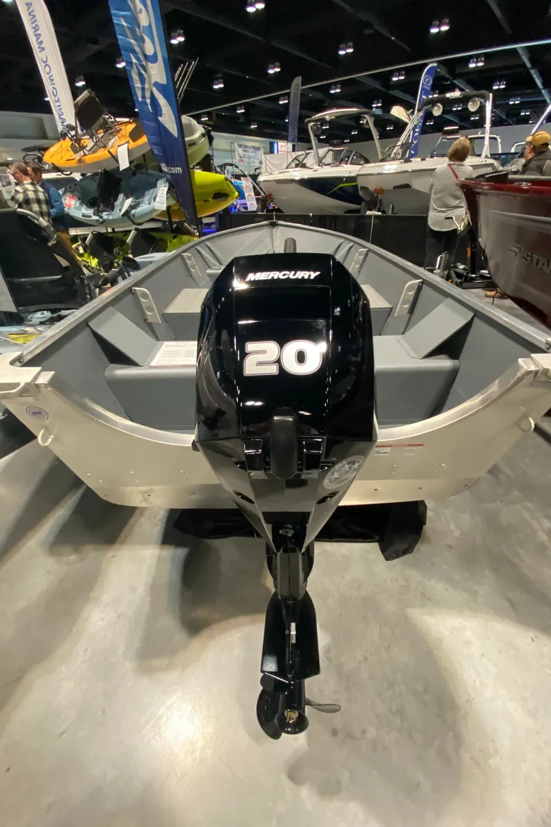 Slide: The Image of 2023 Starcraft Alaskan boat with Mercury 20 outboard motor at a boat show. - 8