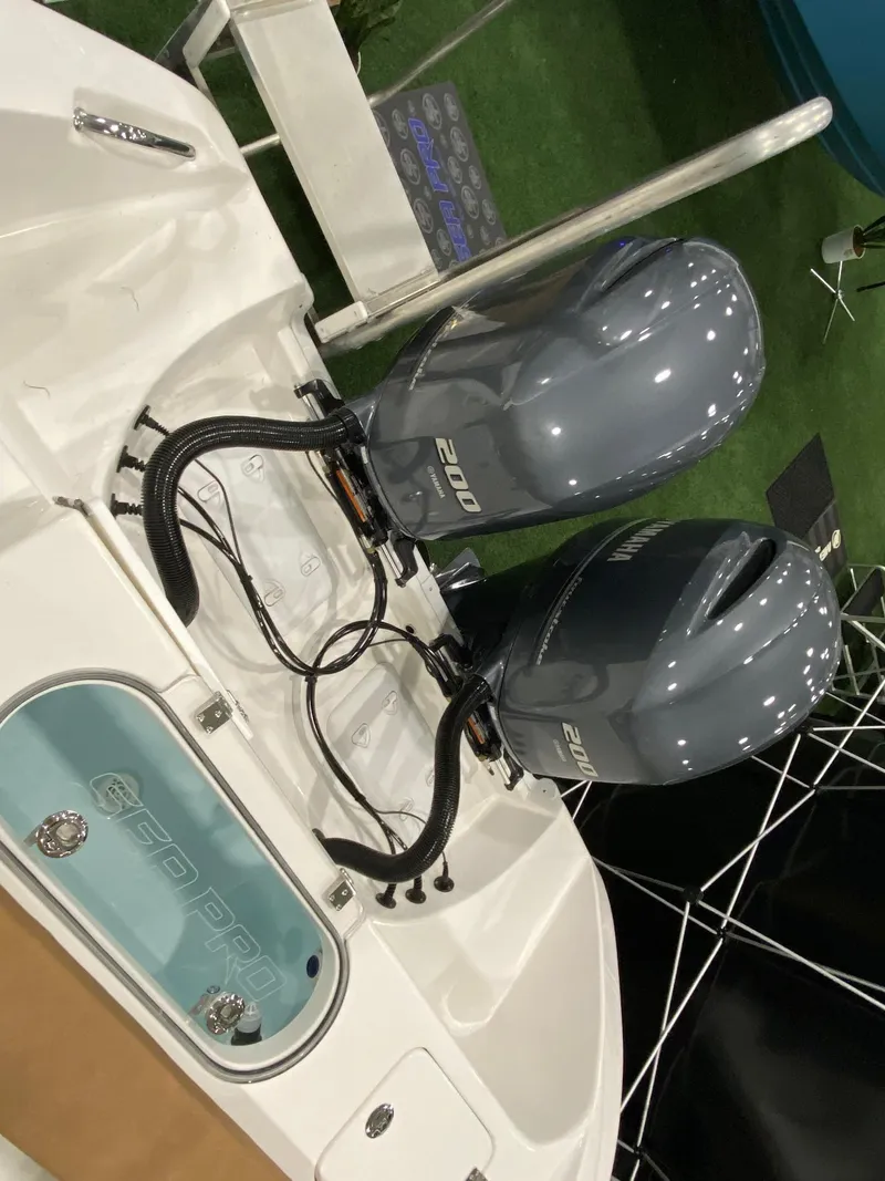 Slide: The Image of 2023 Sea Pro 259 DLX boat with dual 200 horsepower engines. - 14