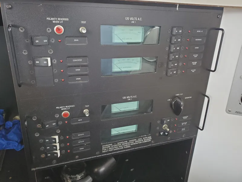 Slide: The Image of Electrical control panel on a 1990 Mainship Mediterranean boat. - 16