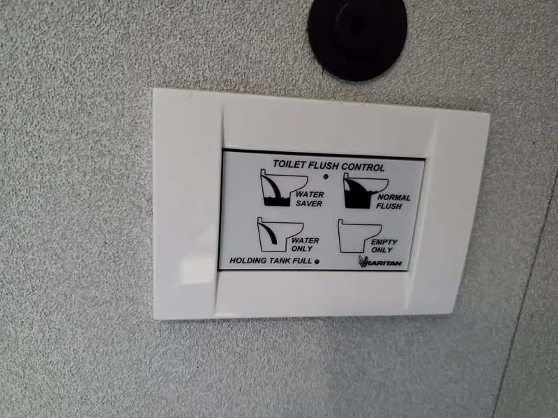 Slide: The Image of Toilet flush control panel on 1990 Mainship Mediterranean boat. - 19