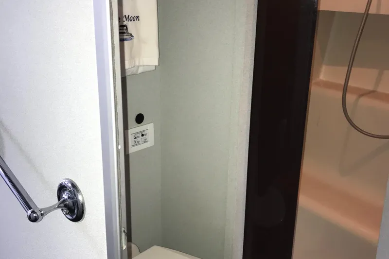 Slide: The Image of 1990 Mainship Mediterranean yacht bathroom with shower and towel rack. - 29