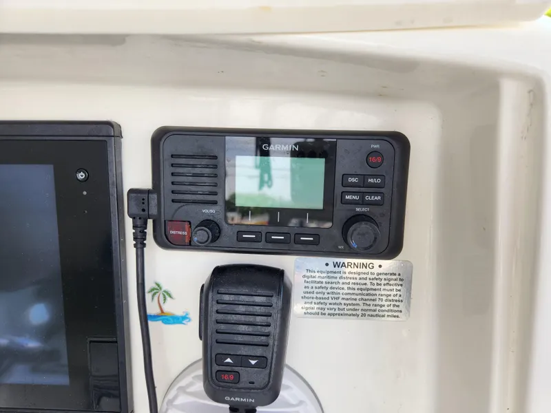 Slide: The Image of Garmin marine radio and display on 2008 Boston Whaler 320 Outrage Cuddy Cabin. - 10