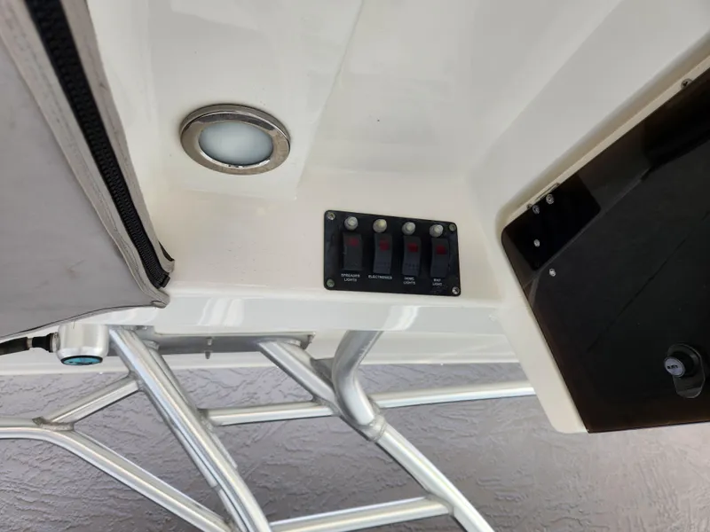 Slide: The Image of Control panel and light on 2008 Boston Whaler 320 Outrage Cuddy Cabin boat. - 13