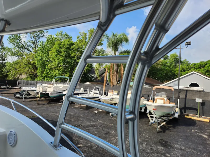 Slide: The Image of 2008 Boston Whaler 320 Outrage Cuddy Cabin in boatyard with other vessels. - 14