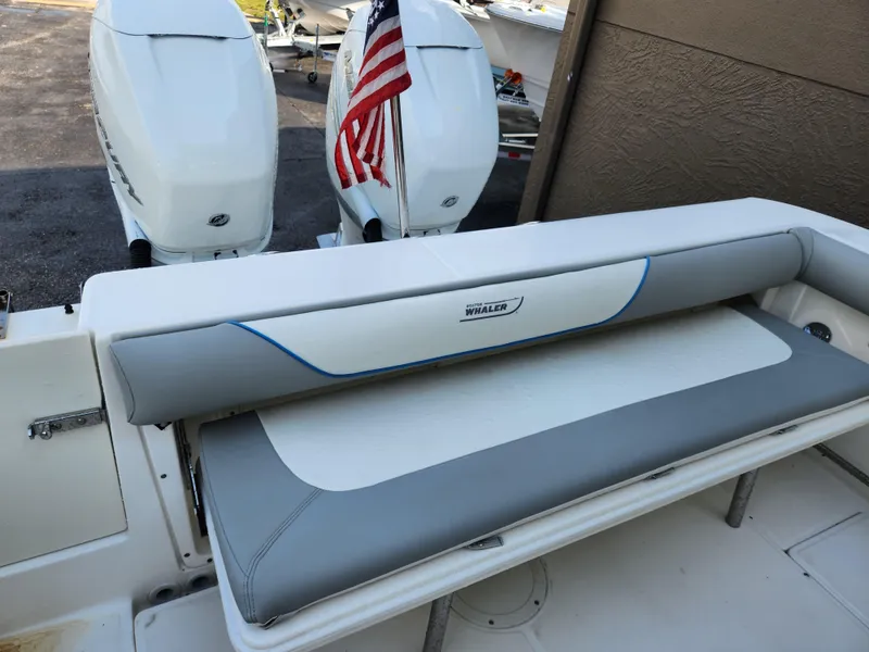 Slide: The Image of 2008 Boston Whaler 320 Outrage Cuddy Cabin with American flag and twin engines. - 26