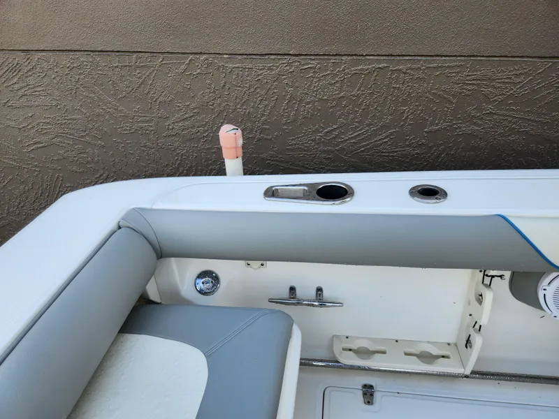 Slide: The Image of 2008 Boston Whaler 320 Outrage Cuddy Cabin interior detail with seating and rod holders. - 27