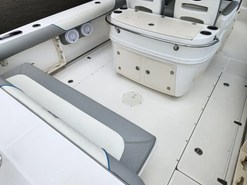 Slide: The Image of 2008 Boston Whaler 320 Outrage Cuddy Cabin interior with seating and storage. - 3