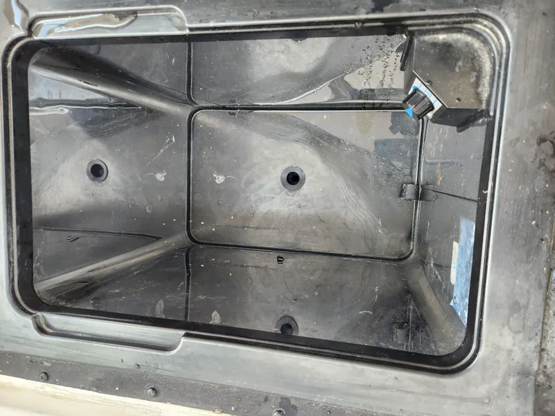 Slide: The Image of Empty storage compartment of a 2008 Boston Whaler 320 Outrage Cuddy Cabin boat. - 31