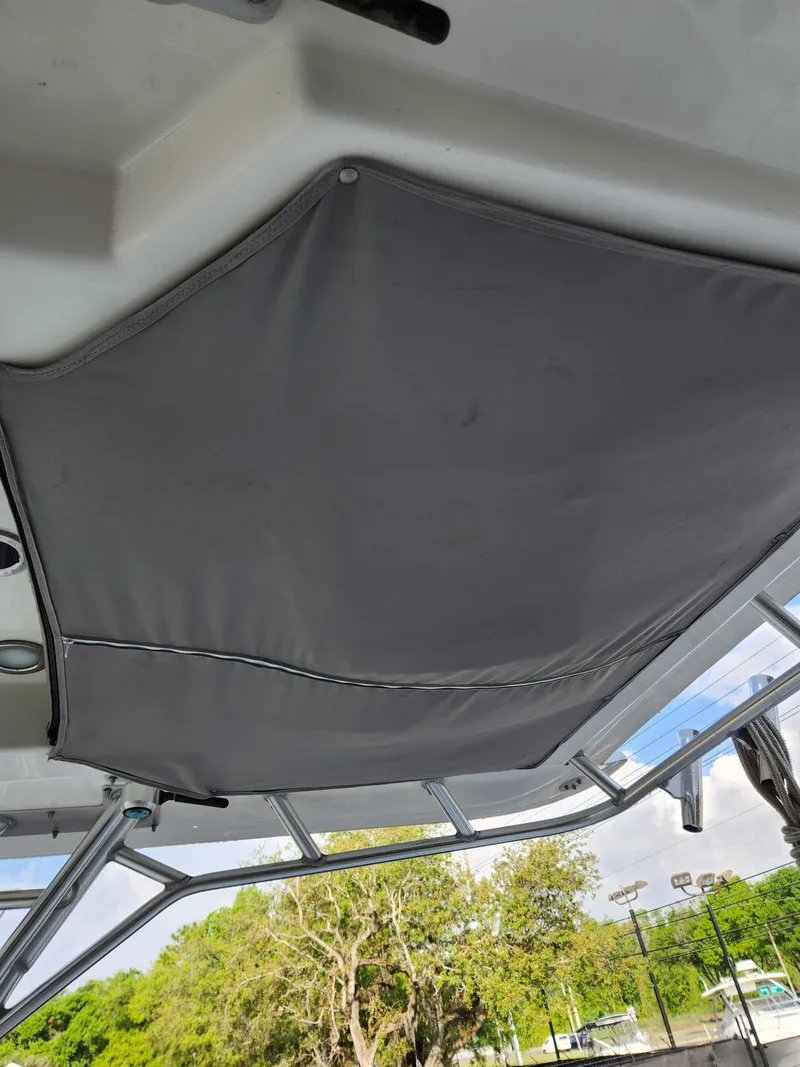 Slide: The Image of 2008 Boston Whaler 320 Outrage Cuddy Cabin interior canopy view. - 32