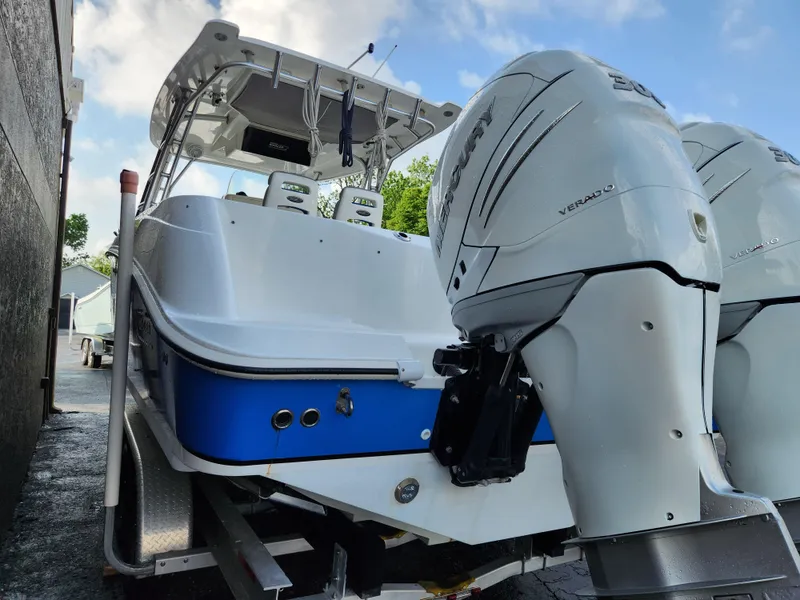 Slide: The Image of 2008 Boston Whaler 320 Outrage Cuddy Cabin with dual engines on trailer. - 36