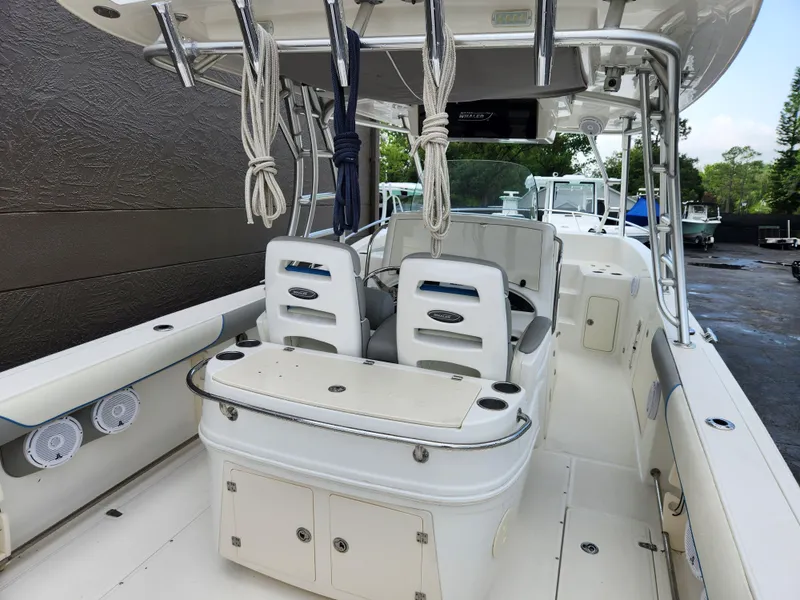 Slide: The Image of 2008 Boston Whaler 320 Outrage Cuddy Cabin interior with seating and storage. - 4