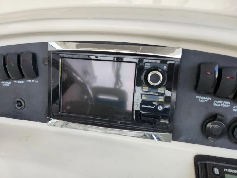 Slide: The Image of 2008 Boston Whaler 320 Outrage Cuddy Cabin dashboard with navigation controls. - 9