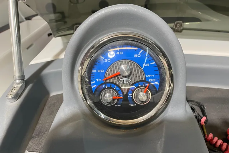 Slide: The Image of Dashboard of a 2021 Tahoe T18 boat with speedometer and gauges. - 14