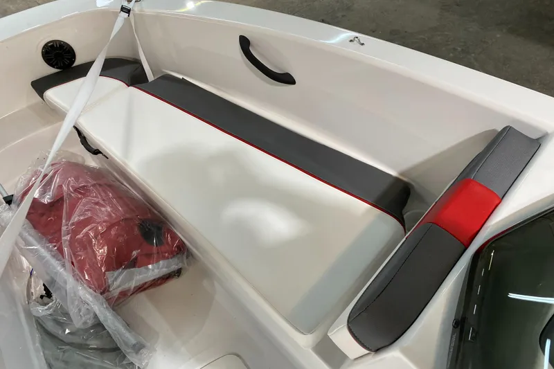 Slide: The Image of 2021 Tahoe T18 boat interior with gray and red seating, featuring a sleek design. - 9