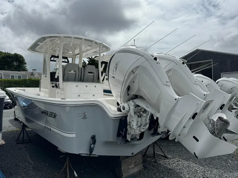 Slide: The Image of 2024 Regulator 30XO boat with dual outboard engines on display. - 13