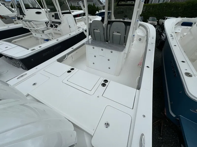 Slide: The Image of 2024 Regulator 30XO boat interior with seating and storage compartments. - 15