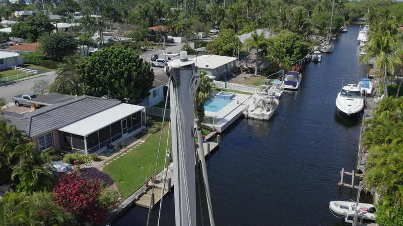 Slide: The Image of Aerial view of a canal with boats, including a 1986 O'Day 39 Aft Cockpit. - 18