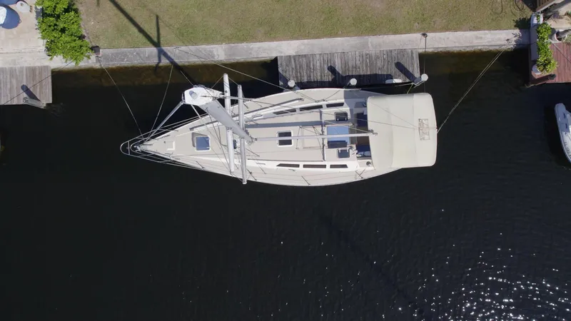 Slide: The Image of Aerial view of 1986 O'Day 39 Aft Cockpit sailboat docked in a canal. - 19