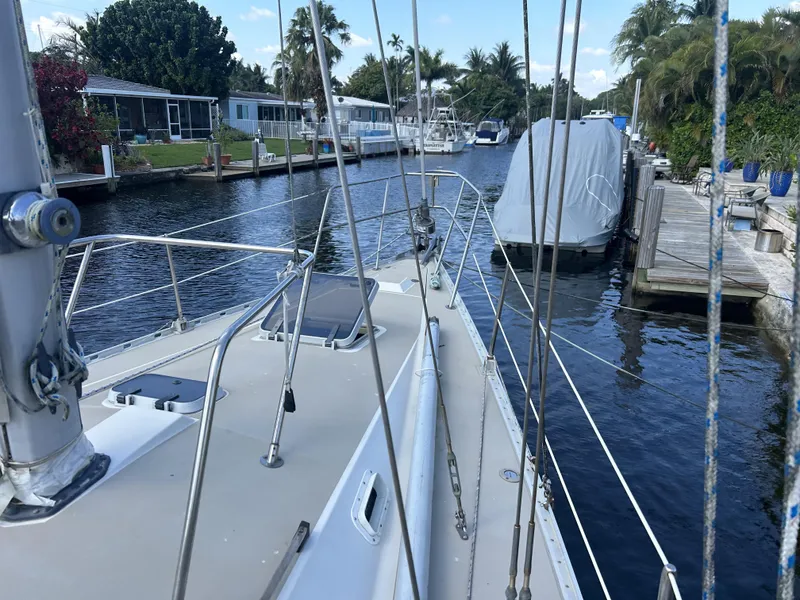 Slide: The Image of Sailboat docked in a canal, O'Day 39 Aft Cockpit, 1986 model. - 25
