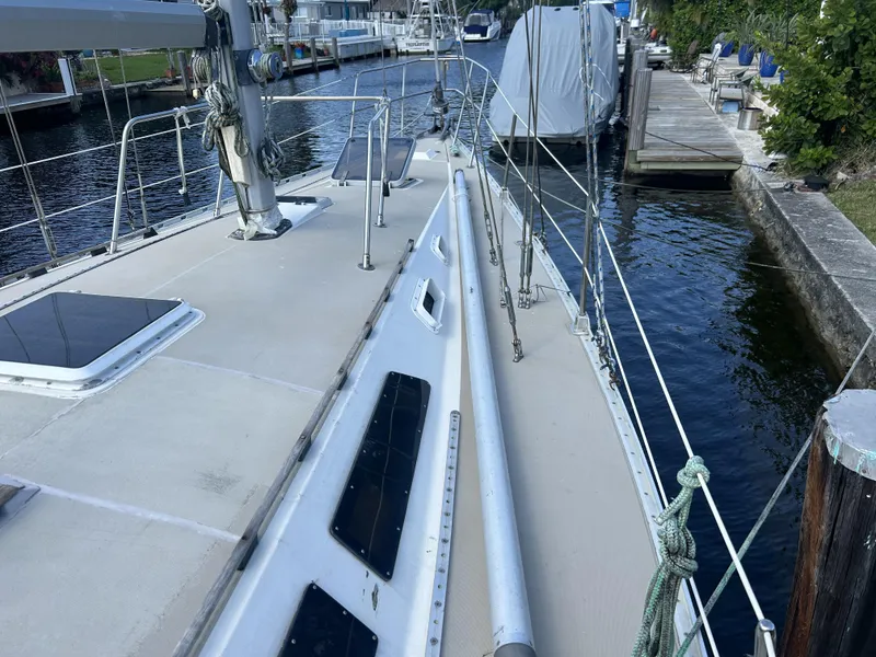 Slide: The Image of 1986 O'Day 39 sailboat docked, showing deck and rigging details. - 26