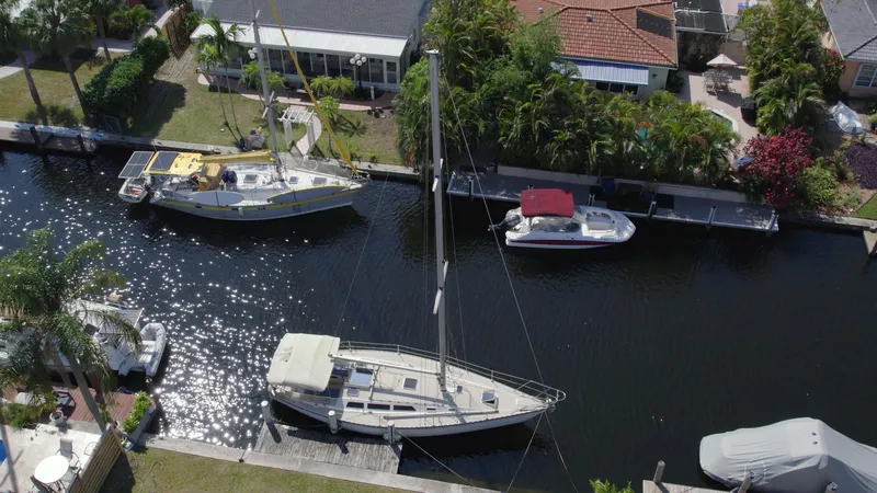 Slide: The Image of Aerial view of 1986 O'Day 39 sailboat docked in a residential canal. - 3