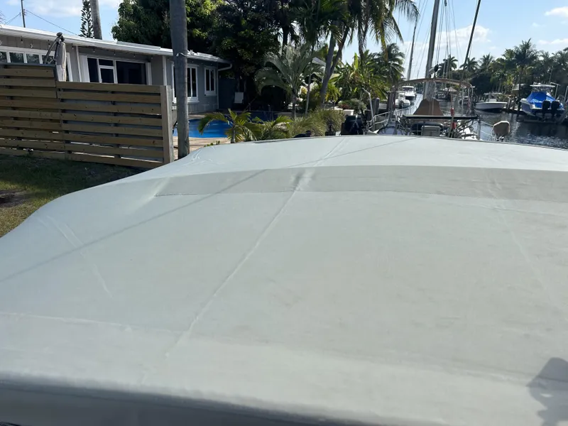 Slide: The Image of 1986 O'Day 39 Aft Cockpit sailboat docked near waterfront home. - 30