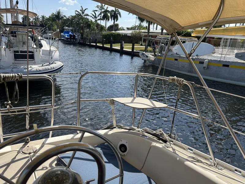 Slide: The Image of 1986 O'Day 39 sailboat in marina, aft cockpit view, sunny day. - 33