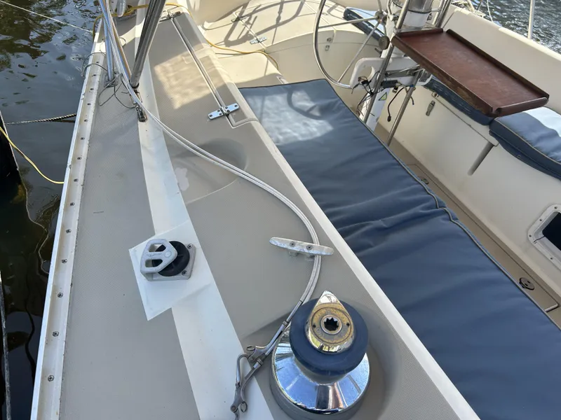 Slide: The Image of 1986 O'Day 39 sailboat deck with winch and seating area. - 36