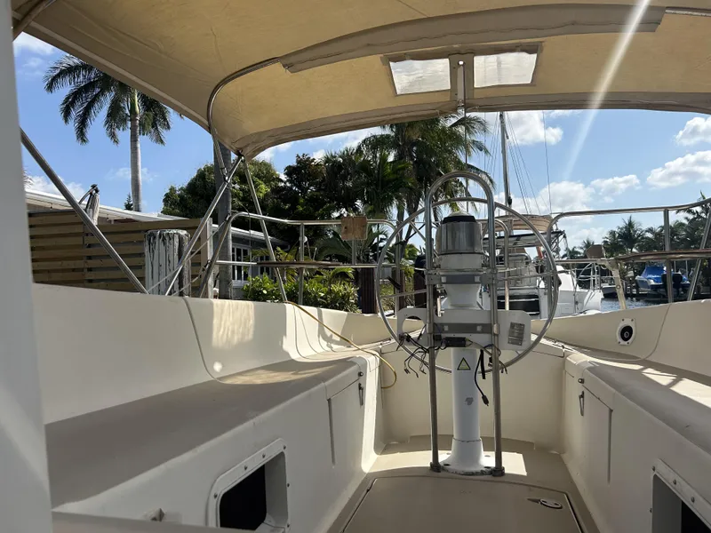Slide: The Image of 1986 O'Day 39 Aft Cockpit sailboat with 4ft 9in draft, docked under sunny skies. - 40