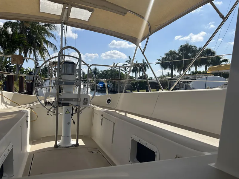 Slide: The Image of 1986 O'Day 39 Aft Cockpit sailboat, spacious deck, sunny marina setting. - 41