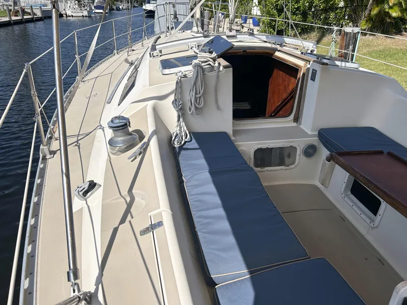 Slide: The Image of 1986 O'Day 39 sailboat aft cockpit with blue cushions and open cabin entry. - 43