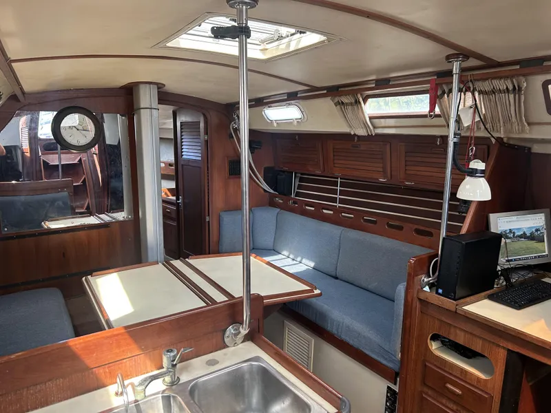 Slide: The Image of Interior of 1986 O'Day 39 sailboat with cozy seating and wooden finishes. - 49