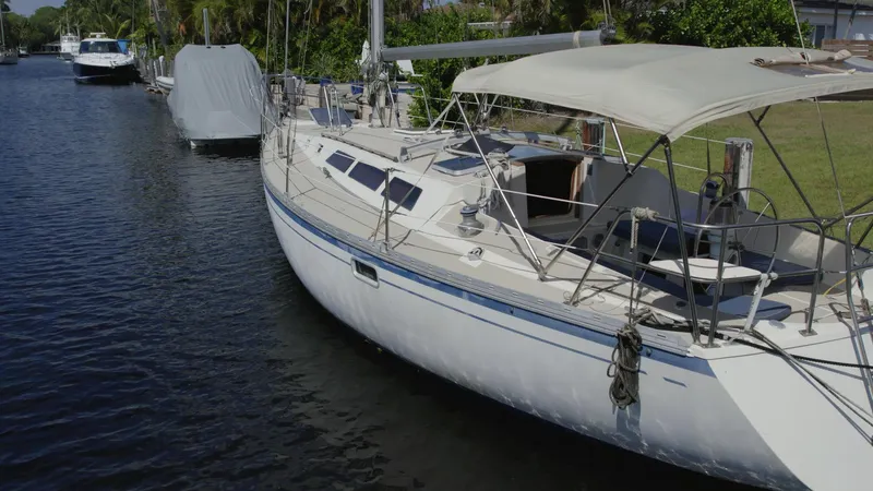 Slide: The Image of 1986 O'Day 39 sailboat with aft cockpit docked in a canal. - 5