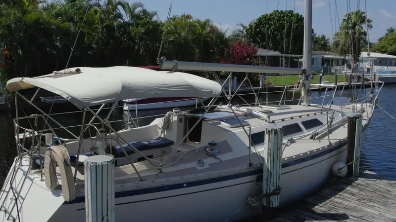 Slide: The Image of 1986 O'Day 39 sailboat docked, featuring aft cockpit and 4ft 9in draft. - 8