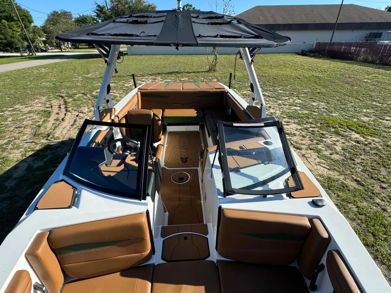 Slide: The Image of 2023 Axis A225 boat with tan interior and black canopy. - 11