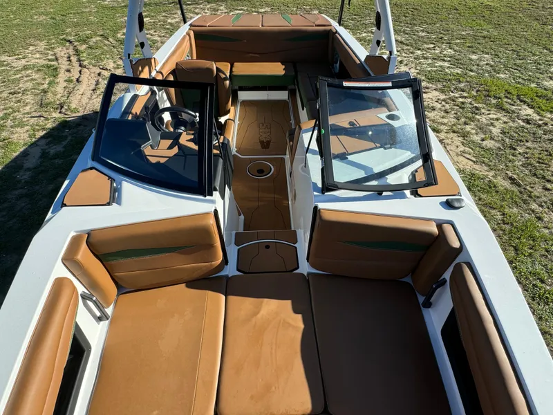 Slide: The Image of 2023 Axis A225 boat with brown interior and open bow seating. - 12