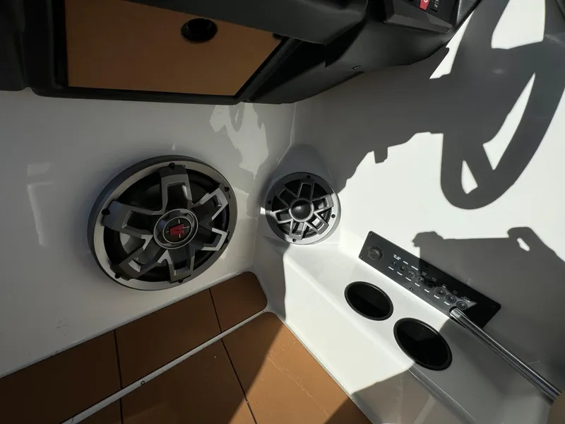 Slide: The Image of 2023 Axis A225 boat interior with speakers and control panel. - 18
