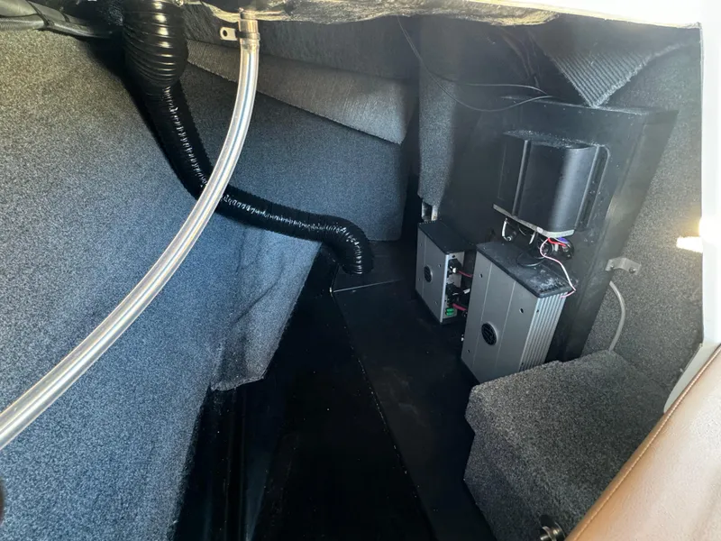 Slide: The Image of Interior of 2023 Axis A225 boat showing storage and mechanical components. - 27