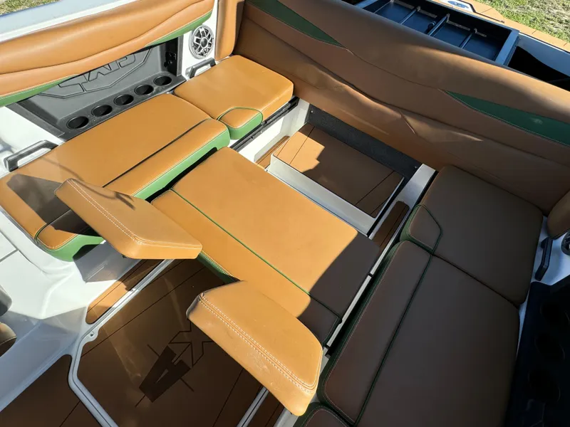 Slide: The Image of 2023 Axis A225 boat interior with tan and green seating. - 32