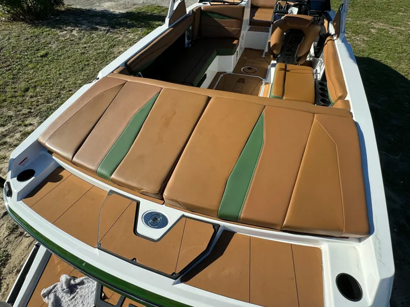 Slide: The Image of 2023 Axis A225 boat with tan and green upholstery. - 34
