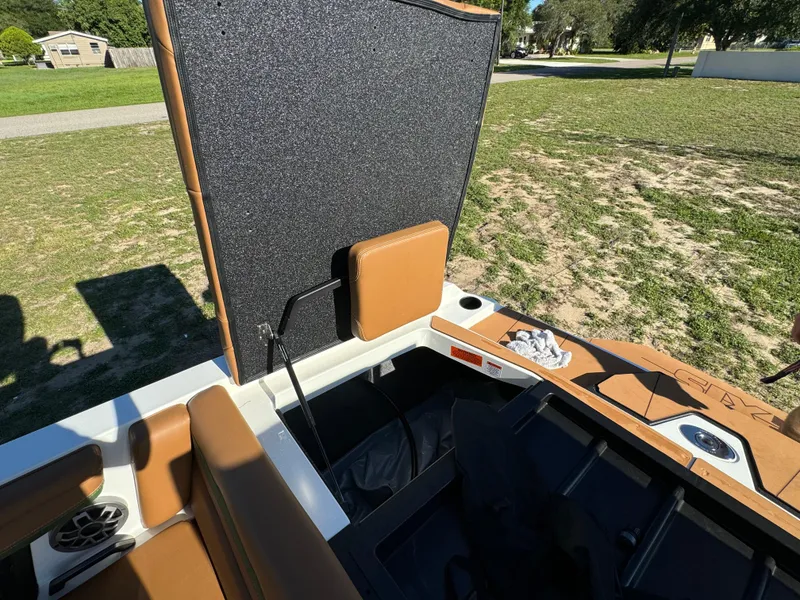 Slide: The Image of 2023 Axis A225 boat interior with open storage compartment. - 37