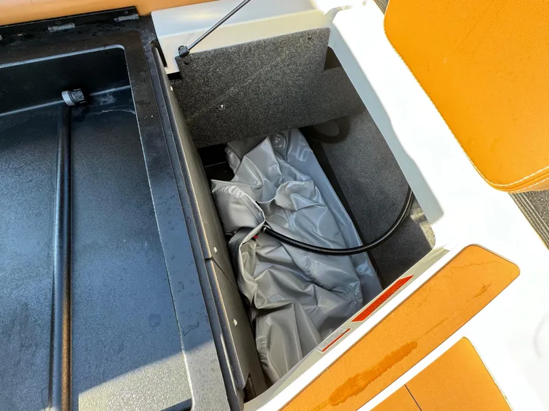 Slide: The Image of 2023 Axis A225 boat storage compartment with ballast bag and hose. - 39